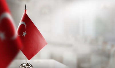 Small flags of the Turkey on an abstract blurry background