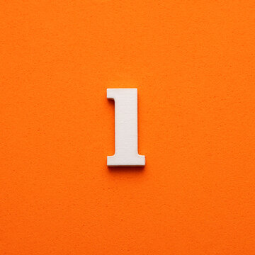 White lowercase letter l on orange foamy background