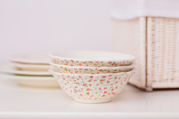 Closeup of porcelain plates and bowls
