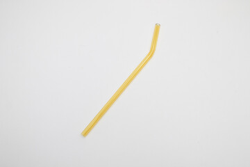 Yellow glass reusable straw isolated on white background. Ecological item for drinking