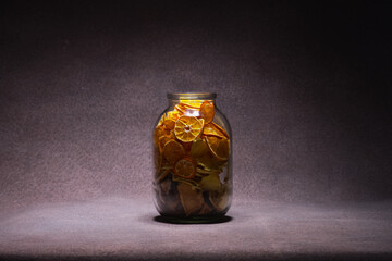 Glass jar with dried oranges. Decorative elements