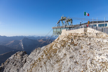 Fototapeta na wymiar The summit station of the Sass Pordoi cableway on a beautiful autumn day in the Dolomite mountains in Italy