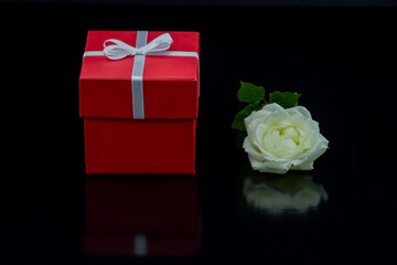 Souvenirs and gift packages on black background.