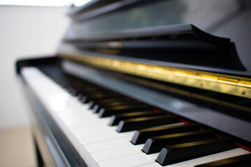 Fototapeta na wymiar close up of a piano keyboard, side view