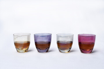 colored glass goblet with cognac and cheese