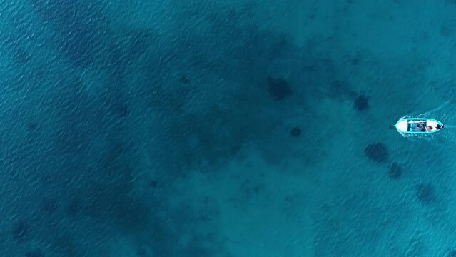 bird's eye drone view of yacht sailing in the sea