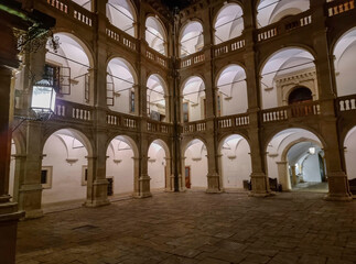 Obraz premium The arcaded inner courtyard of The Styrian Armoury (Landhaus building), a masterpiece of the Italian Renaissance, by night, in Graz, Steiermark, Austria