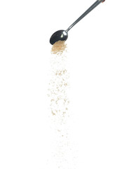 Brown Sugar fall, brown grain sugar pouring down abstract cloud fly from silver spoon. Beautiful complete seed sugarcane, food object design. Selective focus freeze shot white background isolated