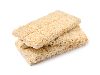 Tasty sesame kozinaki bars on white background