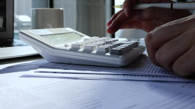 Financial accountant calculates accounts and statistics financial statements
