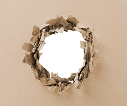 The brown cardboard is perforated, torn, accidental or punctured.