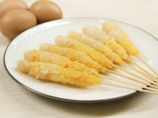 Telor gulung ( egg rolls ) indonesia  street food in white plate.