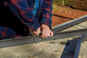 Process of assembling plastic shed that will be placed in backyard