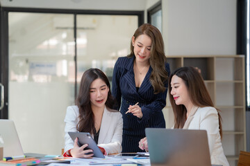Obraz premium Young business team working with business report document on office desk. Brainstorming Business People Design Planning, Brainstorming Planning Partnership.