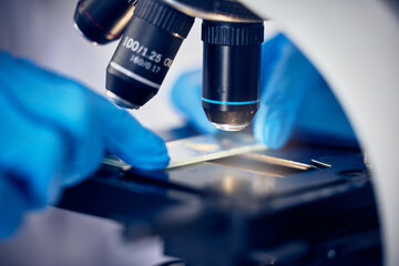 Microscope, bacteria or hands working in a science or chemistry laboratory for future healthcare...