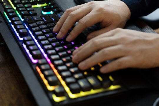 Person typing on keyboard.