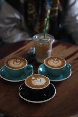 hand holding a cup of coffee