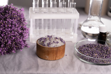 Cosmetic with lavender flowers, pink salt, herbal in lab. natural organic beauty product concept....