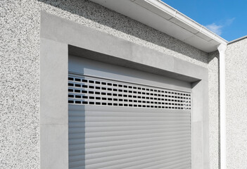 Roller shutter gate. Metal roller garage door as background. Automatic electric roll-up garage gate. Garage with rolling gates.