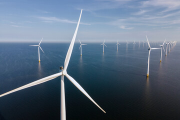 Wind turbine from an aerial view, Drone view at windpark a windmill farm in the lake IJsselmeer the biggest in the Netherlands, Sustainable development, renewable energy. © Fokke Baarssen