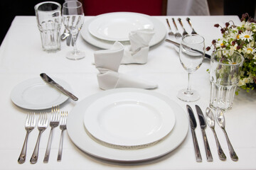 Served dinner table in a restaurant. Restaurant interior