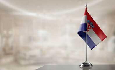 A small Croatia flag on an abstract blurry background