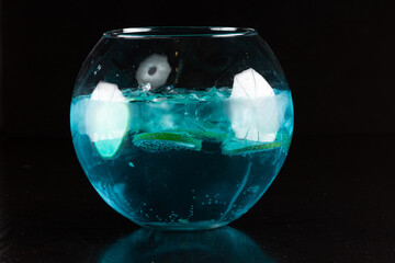 Blue lagoon cocktail with blue curacao liqueur, vodka, lemon juice and soda