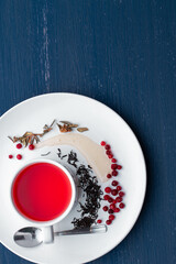 Cup of healthy traditional herbal rooibos red beverage tea on wooden table