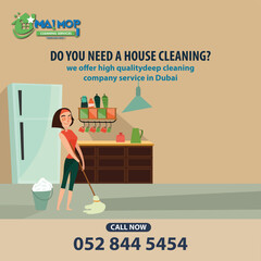 Cleaning service with professional equipment during work An employee of a professional cleaning service in overalls washes the glass of the windows of the facade of the building.