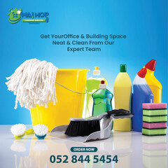 Cleaning service with professional equipment during work An employee of a professional cleaning service in overalls washes the glass of the windows of the facade of the building.