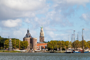 The Dutch city of Enkhuizen seen from the water under summer clouds