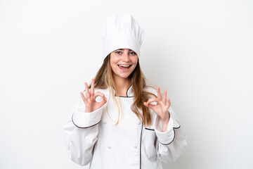 Young caucasian chef woman isolated on white background showing an ok sign with fingers