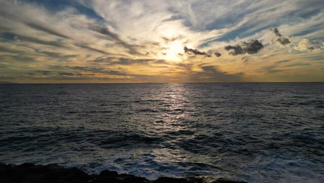 A beautiful sunset over the ocean filmed by drone