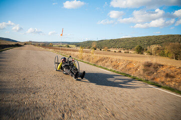 Athlete with disability training with His Handbike on a Track. High quality photography.