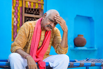 Indian farmer in depression at home.
