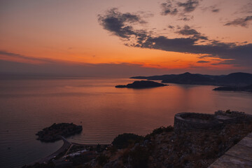 Fototapeta na wymiar view of beauty sunset over Sveti Stefan, small islet and resort in Montenegro. Balkans, Adriatic sea, Europe.