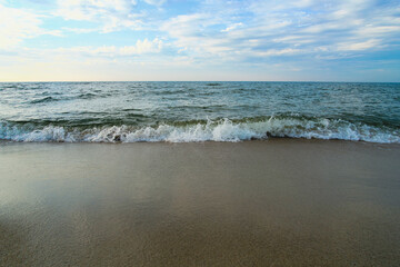 Beach Baltic Sea coast with quartz sand and rolling waves.