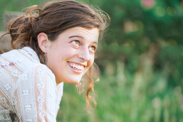 Young woman with smiling look in nature