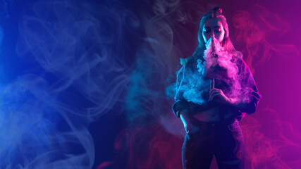 Obraz premium Woman smokes vape. Young girl with electronic cigarette. Woman smoker uses vaping. Lady student blowing smoke from nose. Hipster with vape device in neon light. Use of vape technologies.