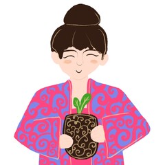 a girl of Asian appearance holds a pot with a flower and smiles