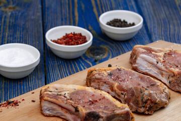 Raw pork meat . Chops on wooden background