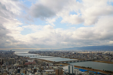 Overhead view of Osaka's Umeda area from a hill on a cloudy day