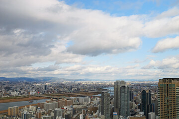 Overhead view of Osaka's Umeda area from a hill on a cloudy day