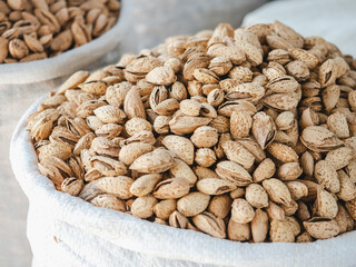 Bags and bowls with fragrant spices lying in the market on a sunny, clear day. Closeup, outdoors, no people. Tasty and healthy food concept