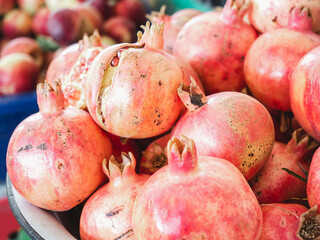 Fresh, ripe fruits lying in the market on a sunny, clear day. Close-up, outdoors, no people. Tasty and healthy food concept