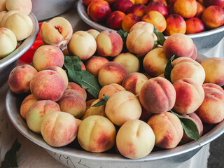 Fresh, ripe fruits lying in the market on a sunny, clear day. Close-up, outdoors, no people. Tasty and healthy food concept