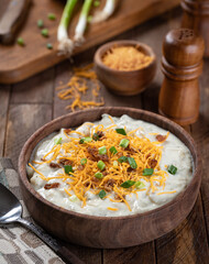 Cream of potato soup with bacon, cheese and green onions