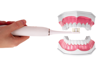 Brushing, cleaning teeth, upper jaw with electric toothbrush isolated on white background. Oral dental hygiene concept
