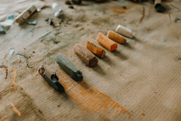 Chalk Pastels in Art Studio on Brown Paper, Art Tools for Art Classes and Materials in Orange, Brown and Green