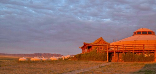 Sunrise on Mongolian traditional gers lodge in Gobi Desert, Mongolia  - obrazy, fototapety, plakaty